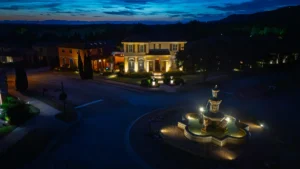 Greenville SC landscape lighting illuminating Italian style home and luxury fountain at night
